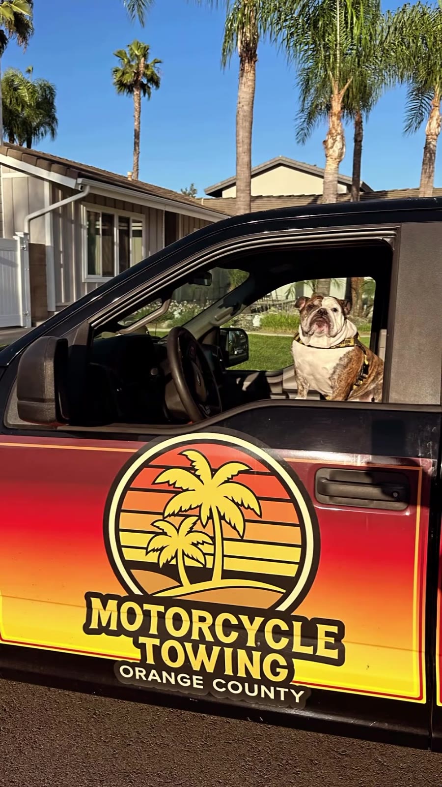 MC Tow OC black truck door logo with bulldog mascot